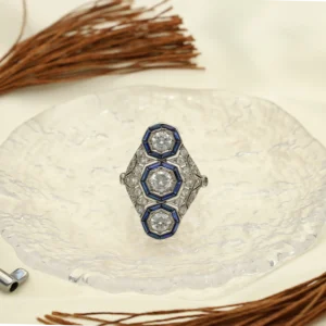 Lanzadera Art Déco de Platino con Zafiros blancos y  Azules